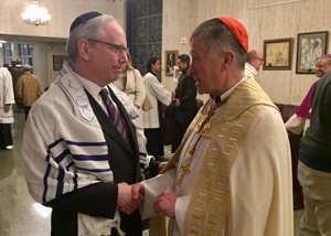 David W. Inlander (left), managing partner of Fischel Kahn, greets Cardinal Blase Cupich at an interfaith service on April 4 commemorating the 50th anniversary of the Rev. Martin Luther King Jr.’s assassination. Inlander is the national chair of the American Jewish Committee’s Interreligious Affairs Commission. The event at St. Rita of Cascia High School on the city’s South Side was part of the Archdiocese of Chicago’s anti-violence initiative. 