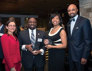 At its 12th annual minority reception Northern Illinois University College of Law presented its Excellence in Service and Leadership Awards to (center) Cook County Circuit Judge Thaddeus L. Wilson, a 1994 NIU law graduate, and Melody Mitchell, NIU’s law alumni director. Also pictured are Dean Jennifer Rosato Perea and 1989 alumnus Vincent F. Cornelius, the event ’s organizer. 