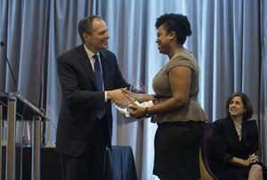 Candace Moore of Chicago Lawyers’ Committee for Civil Rights Under Law accepts the Kimball R. Anderson and Karen Gatsis Anderson Public Interest Law Fellowship from Brian W. Duwe.