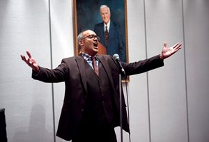 Frank Cargle, a member of The Chicago Bar Association Chorus, sings during a wine-tasting event to benefit the CBA Symphony Orchestra and Chorus.