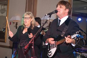 It’s party time as outgoing Illinois State Bar Association president Paula Hudson Holderman gets called to the stage to perform with “John,” “Paul, ” “George” and “Ringo” during the ISBA’s annual installation dinner. Live music was provided by The Cavern Beat, a Beatles cover band. 