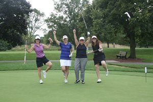 Sue Weitzman, Rosemary Swierk, Paula Holderman and Deane Brown celebrate a birdie at the 21st Annual Women’s Bar Association of Illinois Golf Outing on Aug. 18 at Glenview Park Golf Club in Glenview. 