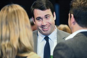 Cook County Assistant State's Attorney Michael Warner mingles at the fifth annual Chicago Volunteer Legal Services Junior Board Vino and Van Gogh event at the Joffrey Tower. The show- case featured works by local artists and students and supported the CVLS. 