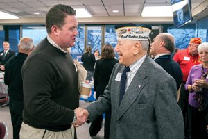 Lake County State's Attorney Michael G. Nerheim greets Pearl Harbor attack survivor Joe Triolo, 93, during the second annual Lake County Veterans History Project on Veterans Day in the Jury Assembly Room of the Lake County Courthouse. Volunteer attorneys and court reporters recorded interviews with World War II veterans. The conversations will be sent to the Library of Congress. 