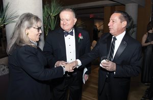 Paula Hudson Holderman of Winston & Strawn; Cook County Circuit Judge Russell W. Hartigan, president of the West Suburban Bar Association; and Circuit Judge Peter A. Felice greet each other at the reception for the WSBA ’s 72nd annual Installation Gala. 