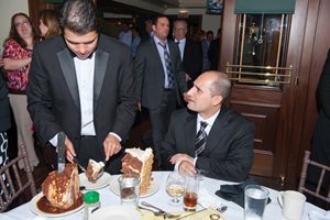 Frank A. Sommario of Romanucci & Blandin tries to explain to the server that he really didn't want the entire carrot cake as he got ready to enjoy dessert at the Justinian Society of Lawyers installation of officers dinner at Gibsons Bar & Steakhouse. Sommario is the group's treasurer. 