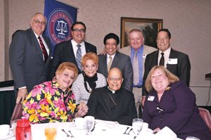 The West Suburban Bar Association honored Cardinal Francis George with its Ethics and the Law Award. Joining the cardinal are (standing, left to right) Barry Locke, Ferdinand Serpe, Jesse Reyes, Ru ssell Hartigan, Peter Felice, (sitting, left to right) Marijane Hemza-Placek, Judy Baar Topinka, the cardinal and Sandra Blake.