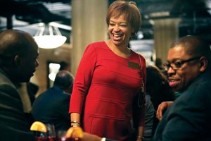 Celestia L. Mays, president of the Cook County Bar Association, enjoys the conversation at the CCBA’s annual Holiday Mingle at River Roast. 
