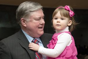 Fred Foreman, the recently retired Lake County Circuit Court chief judge, holds Emily Heydon, 2, the oldest of his three grandchildren, at a Lake County Bar Association reception in his honor. During his career, Foreman also served as an assistant public defender, assistant state’s attorney, Lake County state’s attorney, U.S. attorney for the Northern District of Illinois, private practitioner and circuit court judge. 