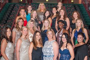 The co-chairs and committee members of the Women’s Bar Association of Illinois’ 100th anniversary gala gather for a group photo Friday in the grand ballroom at Navy Pier.