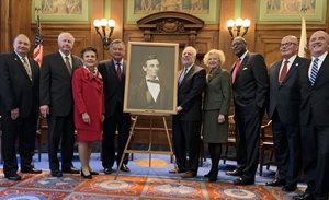 A photograph of Abraham Lincoln taken after he won the Republican nomination for president in 1860 is displayed at the Illinois Supreme Court. The ceremony is part of a campaign to have the same photograph in every courthouse in Illinois. Pictured from left to right are 1st District Appellate Justice Michael B. Hyman; Supreme Court Justices Thomas L. Kilbride and Rita B. Garman; Supreme Court Chief Justice Lloyd A. Karmeier; Supreme Court Justices Robert R. Thomas, Anne M. Burke and P. Scott Neville Jr.; Illinois State Bar Association President  and DuPage County Associate Judge James F. McCluskey and Illinois Judges Association President and Cook County Associate Judge James E. Snyder. 