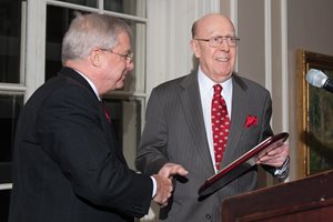 Judge William J. Bauer of the 7th U.S. Circuit Court of Appeals receives an award from Joseph A. Power Jr., founding partner of Power Rogers & Smith, after Bauer gave the keynote address at a Law Day luncheon hosted by the American Board of Trial Advocates Illinois. About 80 people attended the event at the Union League Club. 