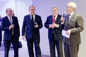 Fischel Kahn celebrated its 100th anniversary with an Oct. 2 party at its office. Offering a toast (from left to right) are principals Morris G. Dyner, Robert W. Kaufman, Joel H. Fenchel and David W. Inlander.