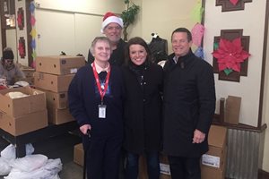 Attorneys from Cogan & Power  donated Christmas meals to Catholic Charities before Christmas, bringing 75 hams and 25 turkeys to the Casa Catalina basic needs center in the Back of the Yards neighborhood. Pictured  are (left to right) Sister Joellen Tumas of Catholic Charities, George T. Brugess, Sara M. Davis and John M. Power.