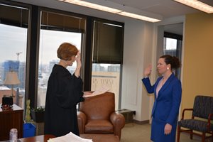 Chief U.S. District Judge Rebecca R. Pallmeyer administers the oath of office Feb. 12 at the Dirksen Federal Courthouse to Beth W. Jantz, who was sworn in as a U.S. magistrate judge for the Northern District of Illinois. Before joining the bench, Jantz served as a staff attorney with the Federal Defender Program since 2008.