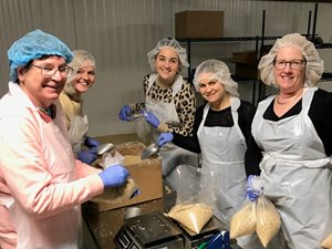 Volunteers from Novack and Macey’s Women’s Initiatives Group repacked food for distribution Jan. 5 at the Greater Chicago Food Depository. The group is co-chaired by partner Rebekah H. Parker and associate Hannah B. Griffin.