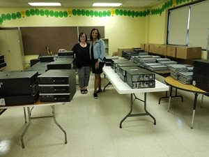 Vedder Price donated 1,120 devices including laptops, desktops, monitors and other supplies to Irma C. Ruiz Elementary School on Chicago’s West Side. School Principal Marla Elitzer (left) and Assistant Principal Vauncia Allen were onsite to receive the equipment from the law firm.