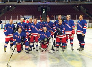 The Chicago Lawyers of the Chicago Masters Hockey League played its sixth annual United Center charity game against the Chicago Celebrity All-Stars to benefit the Chicago Legal Clinic. Pictured are (back row, from left) Michael B. Quigley, David M. Goldman, Lowell D. Snorf III, C.J. Koroll, Patrick D. Thompson, Kevin M. Magnuson, James R. Foley and David Vander Ploeg; and (front row, from left) Kent D. Sinson, Michael B. Goldberg, the Rev. Thomas J. Paprocki and Steven L. Demitro. The Celebrity All-Stars won the game, 5-4.