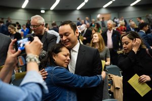 One of Illinois’ 335 newest lawyers receives a congratulatory hug at the swearing-in ceremony on May 9 at the Thompson Center. New attorneys were also sworn in at ceremonies in Springfield, Elgin and Ottawa that day.